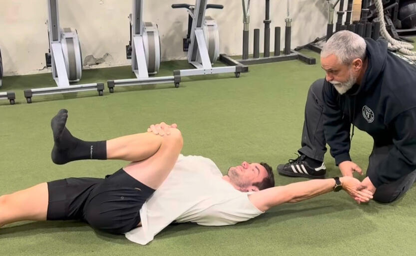 Oakville Personal training Personal trainer assessing a client’s mobility and movement in Oakville